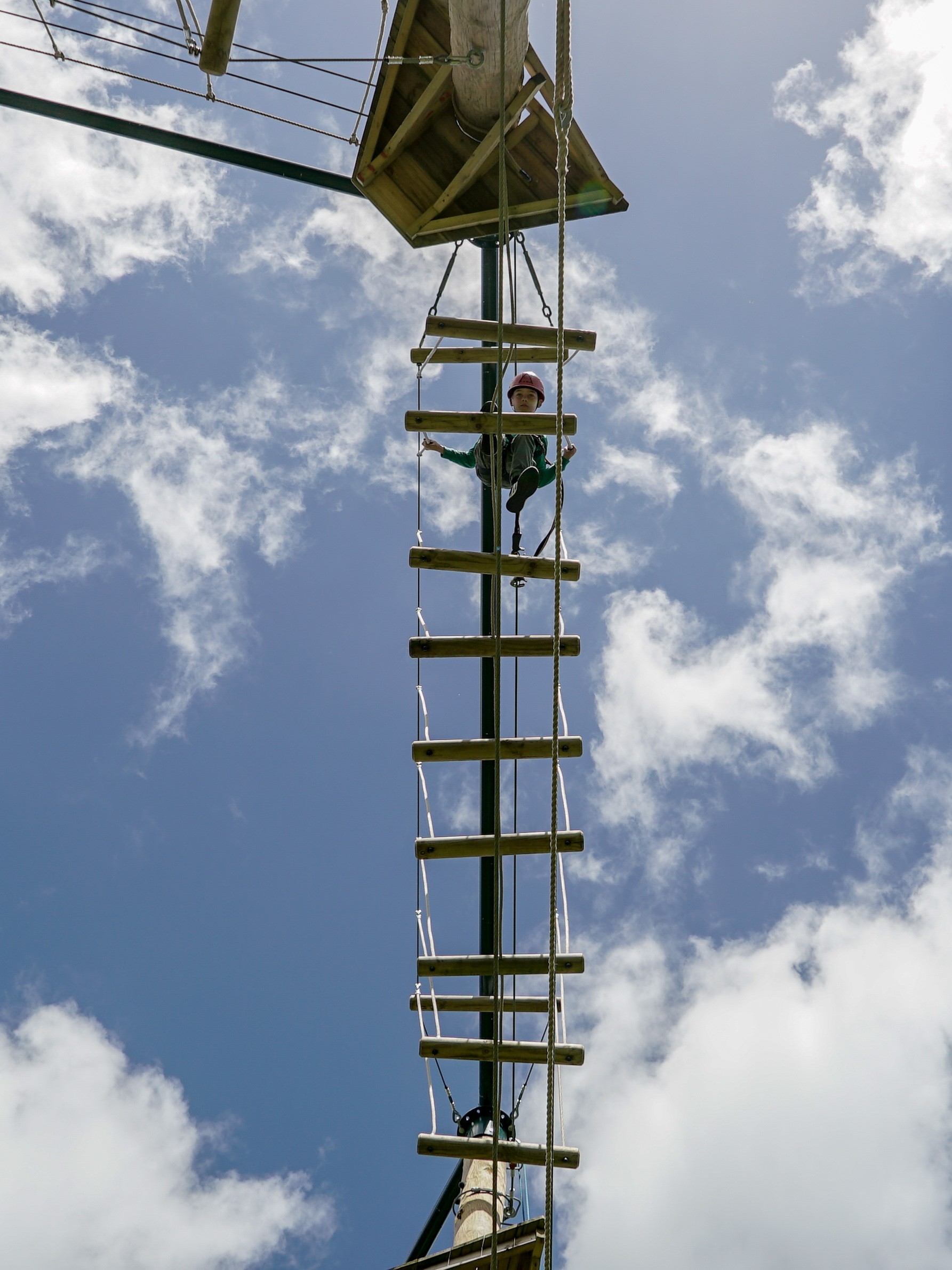 Child on a raised activity course