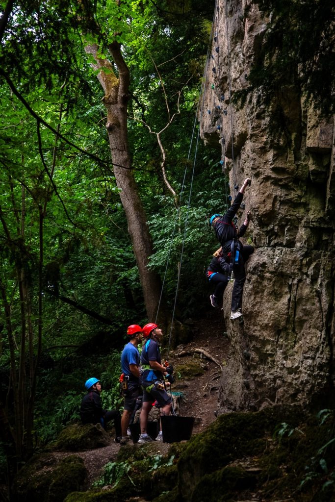People rock climbing