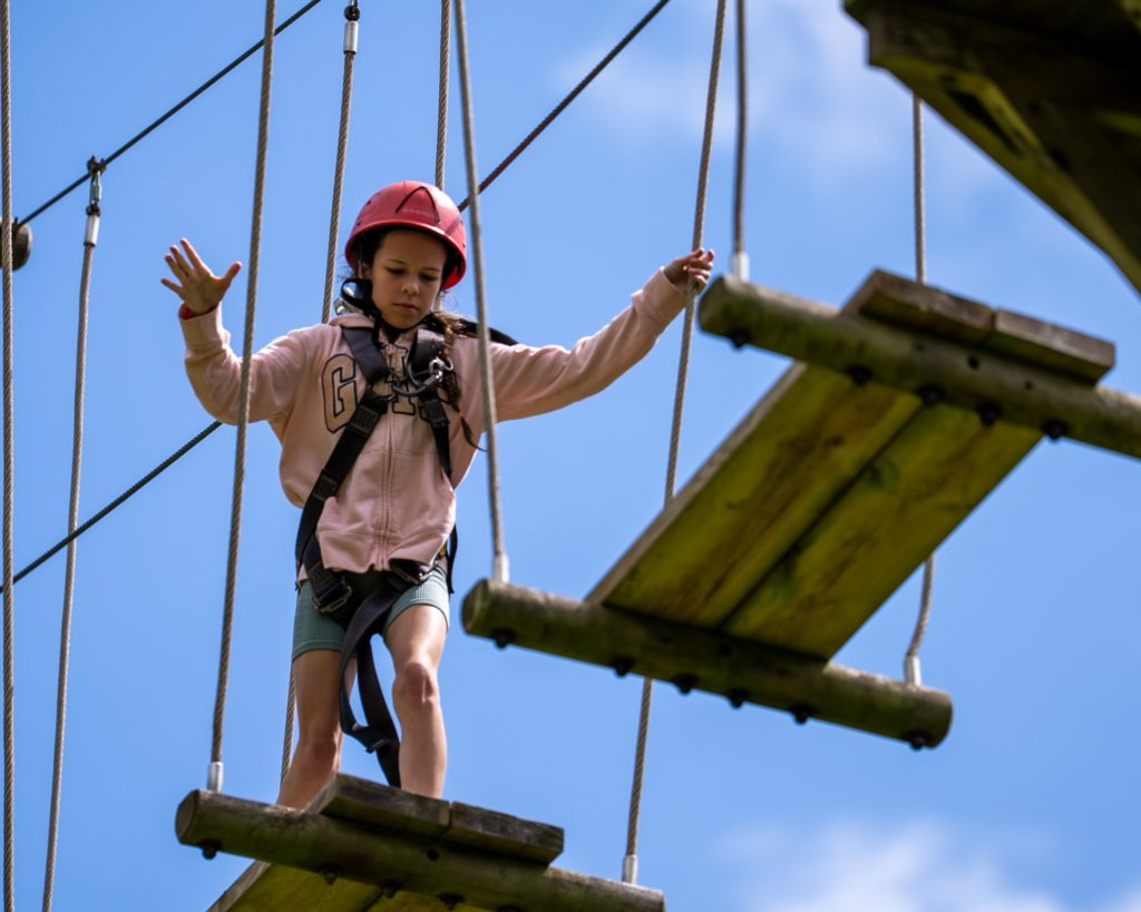 Girl on a raised assault course